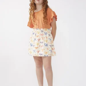 Falda corta de niña estampado lazos