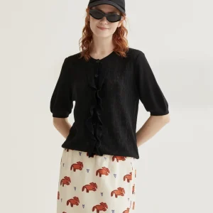 Cárdigan punto floral negro con volantes