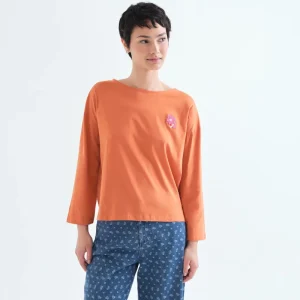 Camiseta 100% algodón naranja con parche de flor
